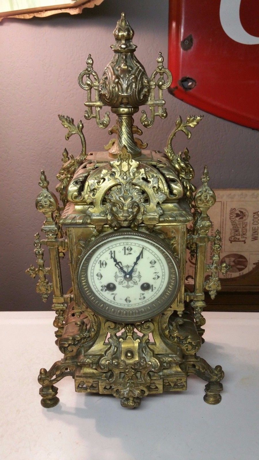 Ornate Brass Antique Mantle Clock w/ Chime Bell Decorated w/ a Lions Head